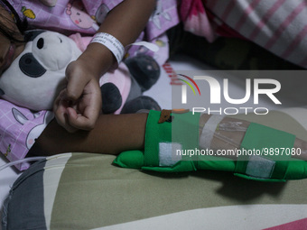 A young girl receive treatment from fever dengue at a hospital in Bogor, West Java, Indonesia on April 11, 2023. The World Health Organizati...