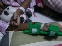 A young girl receive treatment from fever dengue at a hospital in Bogor, West Java, Indonesia on April 11, 2023. The World Health Organizati...