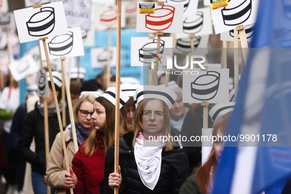 Polish nurses and midwives of hospitals from all the country take part in a protest marching through the streets of Krakow, Poland, on April...