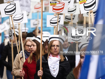 Polish nurses and midwives of hospitals from all the country take part in a protest marching through the streets of Krakow, Poland, on April...