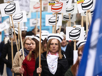 Polish nurses and midwives of hospitals from all the country take part in a protest marching through the streets of Krakow, Poland, on April...