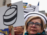 Polish nurses and midwives of hospitals from all the country take part in a protest marching through the streets of Krakow, Poland, on April...