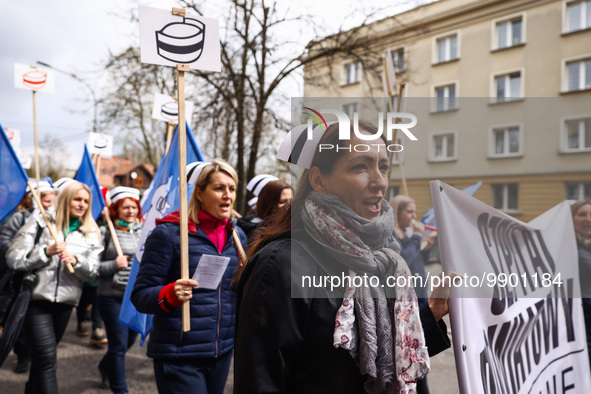 Polish nurses and midwives of hospitals from all the country take part in a protest marching through the streets of Krakow, Poland, on April...