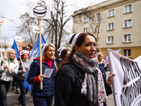 Polish nurses and midwives of hospitals from all the country take part in a protest marching through the streets of Krakow, Poland, on April...