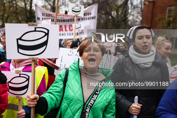 Polish nurses and midwives of hospitals from all the country take part in a protest marching through the streets of Krakow, Poland, on April...