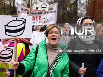 Polish nurses and midwives of hospitals from all the country take part in a protest marching through the streets of Krakow, Poland, on April...