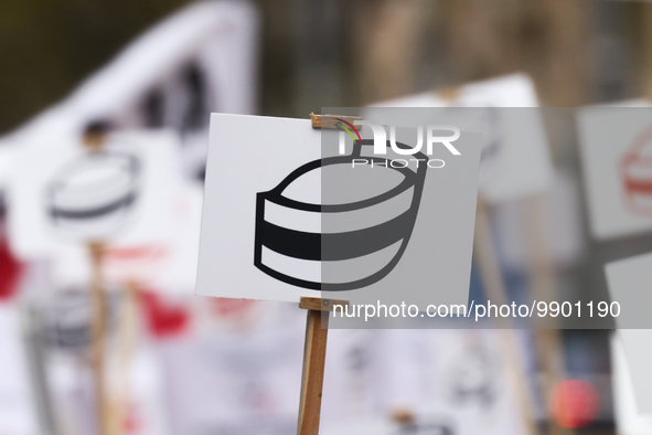 A banner with a symbol of nurse's cap is seen during a protest of Polish nurses and midwives of hospitals from all the country in Krakow, Po...