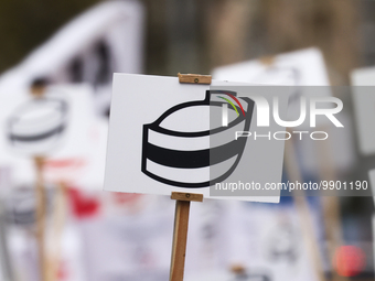 A banner with a symbol of nurse's cap is seen during a protest of Polish nurses and midwives of hospitals from all the country in Krakow, Po...