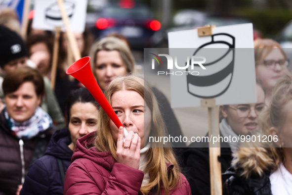 Polish nurses and midwives of hospitals from all the country take part in a protest marching through the streets of Krakow, Poland, on April...