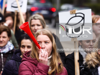 Polish nurses and midwives of hospitals from all the country take part in a protest marching through the streets of Krakow, Poland, on April...