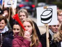 Polish nurses and midwives of hospitals from all the country take part in a protest marching through the streets of Krakow, Poland, on April...