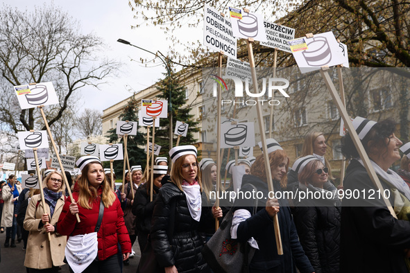 Polish nurses and midwives of hospitals from all the country take part in a protest marching through the streets of Krakow, Poland, on April...