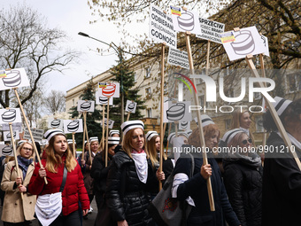 Polish nurses and midwives of hospitals from all the country take part in a protest marching through the streets of Krakow, Poland, on April...