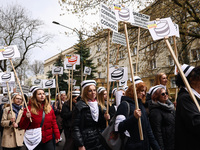 Polish nurses and midwives of hospitals from all the country take part in a protest marching through the streets of Krakow, Poland, on April...