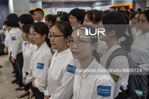 Healthcare Professionals participating in the Exchange Programme posing for a group photo inside the West Kowloon High Speed Railway station...