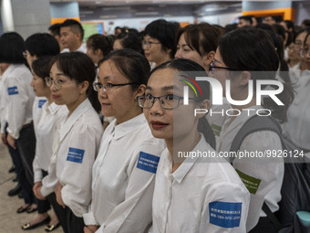 Healthcare Professionals participating in the Exchange Programme posing for a group photo inside the West Kowloon High Speed Railway station...