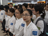 Healthcare Professionals participating in the Exchange Programme posing for a group photo inside the West Kowloon High Speed Railway station...