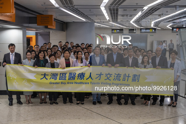 Healthcare Professionals participating in the Exchange Programme posing for a group photo inside the West Kowloon High Speed Railway station...