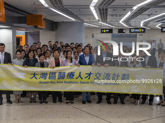 Healthcare Professionals participating in the Exchange Programme posing for a group photo inside the West Kowloon High Speed Railway station...