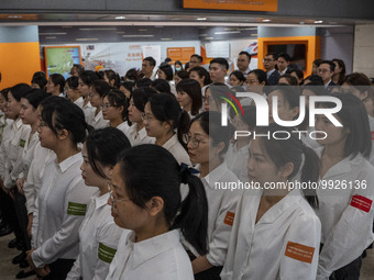 Healthcare Professionals participating in the Exchange Programme posing for a group photo inside the West Kowloon High Speed Railway station...