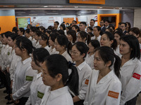 Healthcare Professionals participating in the Exchange Programme posing for a group photo inside the West Kowloon High Speed Railway station...