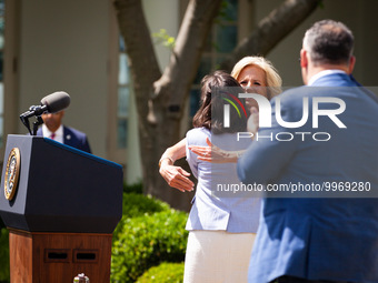 First Lady Dr. Jill Biden embraces Teacher of the Year Rebecka Peterson, a math teacher from Tulsa, OK, at an event honoring Teachers of the...