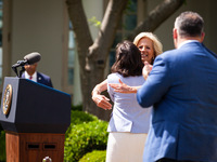 First Lady Dr. Jill Biden embraces Teacher of the Year Rebecka Peterson, a math teacher from Tulsa, OK, at an event honoring Teachers of the...