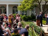 President Joe Biden and attendees applaud the teachers of the year.  President Biden, First Lady Dr. Jill Biden, and Secretary of Education...