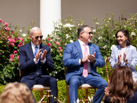 President Joe Biden,Secretary of Education Miguel Cardona, and Teacher of the Year Rebecca Peterson applaud as the First Lady Dr. Jill Biden...