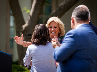 First Lady Dr. Jill Biden embraces Teacher of the Year Rebecka Peterson, a math teacher from Tulsa, OK, at an event honoring Teachers of the...