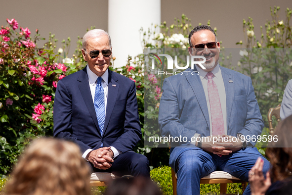 President Joe Biden and Secretary of Education Miguel Cardona sit on stage during an event honoring Teachers of the Year in the White House...