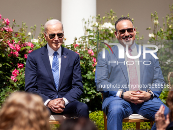 President Joe Biden and Secretary of Education Miguel Cardona sit on stage during an event honoring Teachers of the Year in the White House...